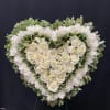 white heart inside of a heart, white roses, white chrisantemums and greens
18