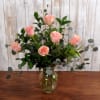 Sending thoughtful greetings and warmest regards, a half-dozen roses with waxflower and
