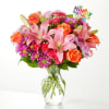 A carefully selected blend of roses, daisies, and lilies make for a