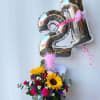 Celebrate a milestone birthday with elegance and color!
This stunning floral arrangement features: