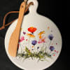 This ceramic serving plate comes with a wooden spreader. 

(Please specify in