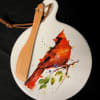 This ceramic serving plate comes with a wooden spreader. 

(Please specify in