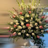 This breathtaking standing floral arrangement radiates elegance and grace, perfect for expressing