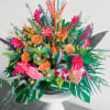 This delightful floral arrangement features a harmonious blend of colors and textures.
