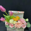 jewlery box filled with, tulips, spray roses, carnations, green button, and silver