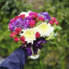 A floral mix of purple hydrangea, white chrysanthemum, &amp; pink spray roses!