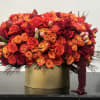 Vibrant and gorgeous floral composition features a harmonious blend of two-tone orange
