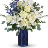A classic for any occasion, this timeless bouquet of white roses and