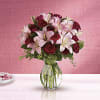 Lovely reds and pinks come together in this lavishly romantic anniversary gift.