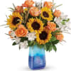 Like an ocean sunset, this bold bouquet of radiant sunflowers and orange