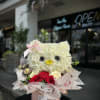 A charming Hello Kitty-themed arrangement featuring a delightful mix of fresh blooms