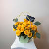 A vibrant and elegant arrangement featuring fresh mini roses and eucalyptus, designed