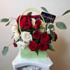 A vibrant and elegant arrangement featuring fresh mini roses and eucalyptus, designed