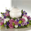 Pay tribute to their remarkable life with a gorgeous tabletop floral arrangement