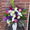 Arriving a in a beautiful ceramic keepsake vase and featuring whites and