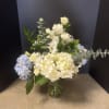 Blue Hydrangea, White Hydrangea, Daisies, Lisianthus, Spray Roses in a glass tuliped
