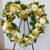 Standing sympathy wreath in the shape of a heart. Made with lush