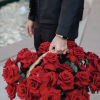 A basket of beautiful red roses is a stunning and captivating arrangement.