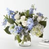 Let this uplifting arrangement be reminders of the clear skies ahead. Capturing