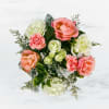 This arrangement includes pink roses, white roses, white spray roses, pink carnations