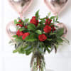 &ldquo;Crimson Elegance&rdquo; is a sophisticated arrangement of one dozen luxurious red roses