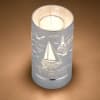 This stylish and modern silver tone Sailboat Seascape touch sensory memory lamp
