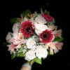 A small handheld bouquet, filled with mixed blooms.

Please note colors in the
