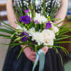 A small handheld bouquet, filled with mixed blooms.

Please note colors in the