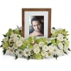 An exquisite round wreath with blooms inspired by the lasting impressions a