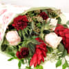 Romantic. Unconventional. 

Gathered, fresh-cut bouquet starring exotic red ginger, soft pink roses