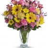 Dazzle someone special with a stylish and bright bouquet! These delightful blossoms