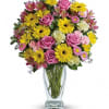 Dazzle someone special with a stylish and bright bouquet! These delightful blossoms