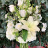 Floral glass vase arrangement with roses, dragon snaps, hydrangeas, gladiolas and foliage