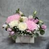 A stunning bag arrangement with a passionate white roses with pink mum