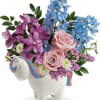 Pale pink roses and pretty pastel petals look oh-so-enchanting in this sweet