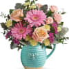 This delightful bouquet includes peach roses, pink spray roses, pink gerberas, yellow