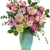 Sweet and stylish, this blushing mix of soft pink roses with bright