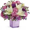 These luxurious lavender roses and crisp white lilies are poised to please!
