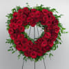 This standing heart spray features 60 + beautiful red roses and a