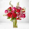 This exquisite bouquet combines the mesmerizing beauty of oriental lilies, classic red