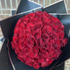 Beautiful red roses wrapped in Black or Brown paper. Perfect for date
