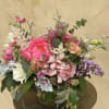 A lush summer medley bursting with romance and color.A dreamy arrangement that