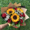 Sunflowers and red roses wrapped in a beautiful hand held bouquet. Nine