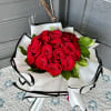 A stunning hand-tied bouquet of red roses, perfect to show that special