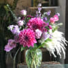 Dinner plate dahlias are the star of this show!  Roses, orchids