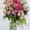 The Sweet Garden Spray offers soft beauty and blushing comfort to honor