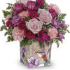 Like a hummingbird flitting around a secret garden, this delightful bouquet of
