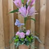  Bright  lilies are uniquely arranged into a topiary and grounded