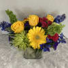 Lovely low lush design with bright vibrant colors. A variety of blooms
