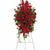 This rich, radiant spray of red roses, gladioli and other popular red